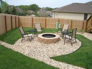 exterior-enchanting-idea-of-the-fire-pit-made-of-stone-on-stone-ground-shaped-into-round-theme-surrounding-by-modern-chairs-awesome-exterior-features-warming-up-for-cool-fire-pit-ideas-546x409